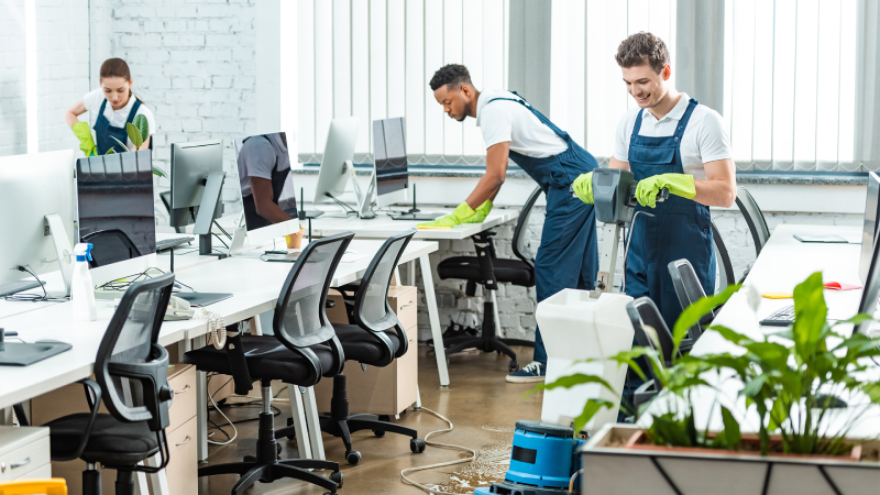 Day porter cleaning staff disinfecting office surfaces in Mobile